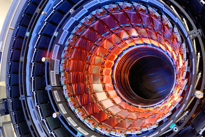 The silicon strip tracker of the Compact Muon Solenoid (CMS) nears completion. Shown here are three concentric cylinders, each comprised of many silicon strip detetectors (the bronze-coloured rectangular devices, similar to the CCDs used in digital cameras). These surround the region where the protons collide. (Image from cds.cern.ch)