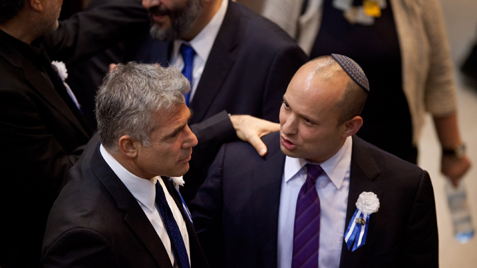 Israeli politician Yair Lapid (L), head of Yesh Atid (There is a Future) party embrace Naftali Bennett, head of the Israeli hardline national religious party the Jewish Home (AFP Photo / Uriel Sinal)