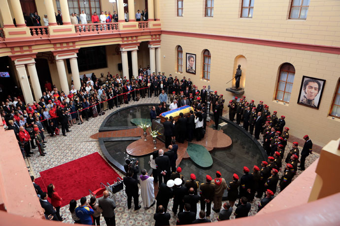 Handout picture released by the Venezuelan presidency showing a general view after the arrival of the coffin with the remains of late Venezuelan President Hugo Chavez to its temporary resting place at the former "4 de Febrero" barracks -- a barracks-turned-museum that the former paratrooper had used as his headquarters during a failed 1992 coup attempt -- in Caracas, on March 15, 2013.(AFP Photo / Presidencia)