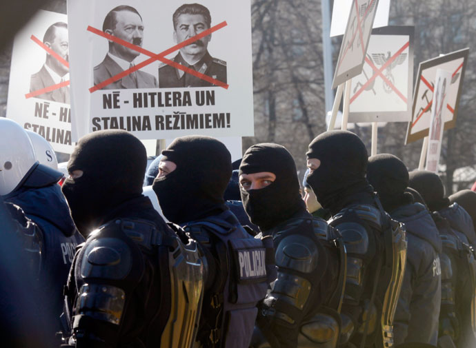 Riot police officers stand guard during the annual procession commemorating the Latvian Waffen-SS (Schutzstaffel) unit, also known as the Legionnaires, in Riga March 16, 2013.(Reuters / Ints Kalnins)