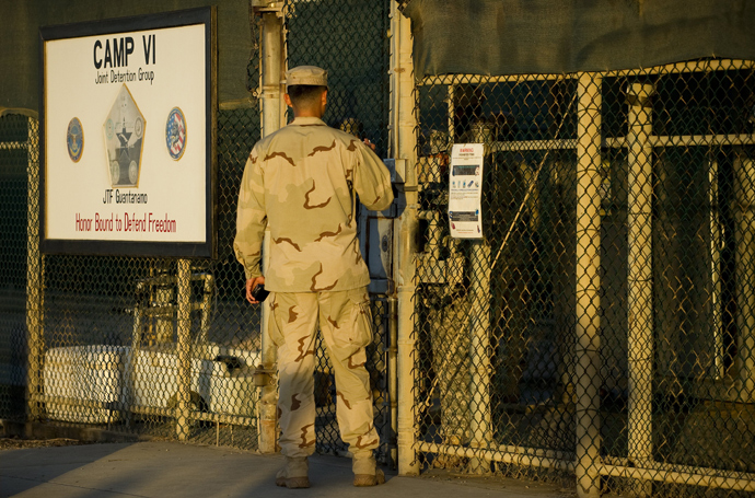 Member of the military asking for enterance at the front gate of "Camp Five" and "Camp Six" detention facility of the Joint Detention Group at the US Naval Station in Guantanamo Bay, Cuba, January 19, 2012 (AFP Photo / Jim Watson)