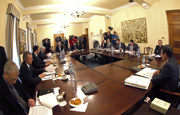 Cypriot President Nicos Anastasiades and his cabinet sit at a meeting at the presidental palace in Nicosia, March 17, 2013, after the euro group of European Union finance ministers decided to impose a levy of up to 10 percent on deposits in return for financial aid to the indebted island. (Reuters)