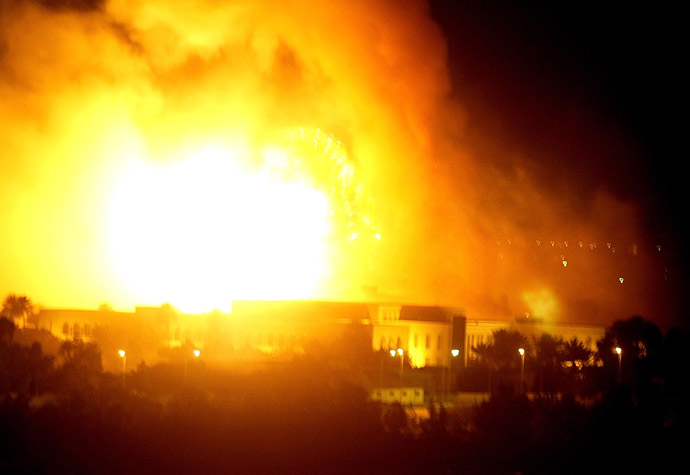 An explosion rocks one of Iraqi President Saddam Hussein's palaces in Baghdad during air strikes March 21, 2003. (Reuters/Goran Tomasevic)