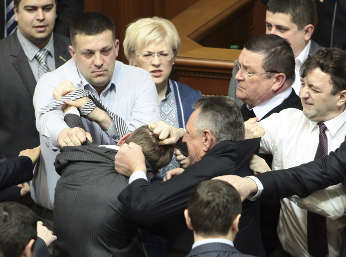 Ukrainian deputies scuffle during a session in the national Parliament in Kiev March 19, 2013. (Reuters)