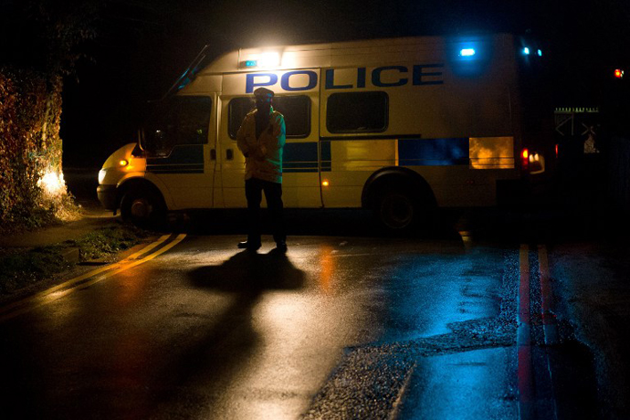 A police van blocks a road near the house of Russian tycoon Boris Berezovsky in Sunningdale, Berkshire, southwest of London, on March 23, 2013. (AFP Photo / Leon Neal)