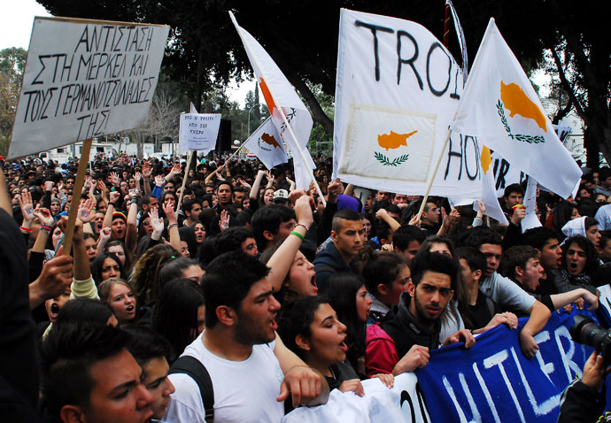 Cypriot students gather outside the parliament in Nicosia during a rally against a bailout for the financially crippled island on March 26, 2013.(AFP Photo / Emily Irving-Swift)