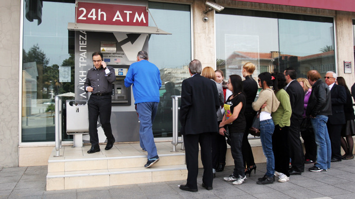 Cyprus toughens capital controls, steps up security ahead of banks reopening