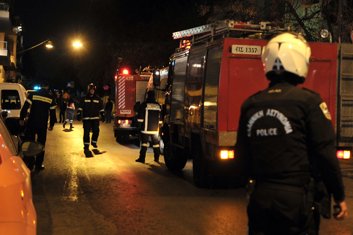 Firmen deploy near the site of a bomb explotion on March 27, 2013 near the Acropolis in Athens (AFP Photo / Louisa Gouliamaki) 