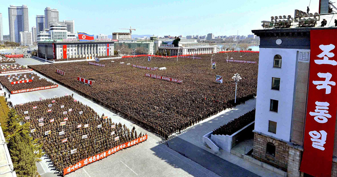 This photo taken on March 28, 2013 and released by North Korea's official Korean Central News Agency (KCNA) on March 29, 2013 shows North Korean leader Kim Jong-Un (front L) making a speech during the meeting of information workers of the whole army in Pyongyang (AFP Photo / KNS)