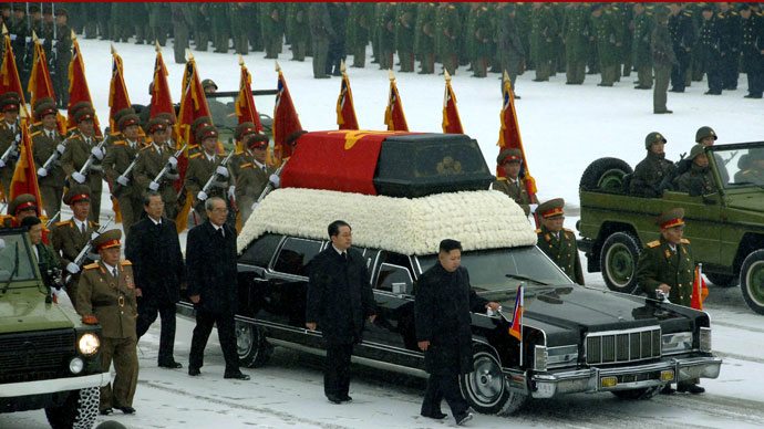 This handout picture taken by North Korea's official Korean Central News Agency (KCNA) on December 28, 2011 shows Kim Jong-Un (center R) and Jang Song-Thaek (C) besides the convoy carrying the body of his father and late leader Kim Jong-Il at Kumsusan Memorial Palace in Pyongyang. North Korean state television began broadcasting the funeral of late leader Kim Jong-Il December 28, with footage of tens of thousands of troops bowing their heads in the snow outside a memorial palace.(AFP Photo / KCNA)