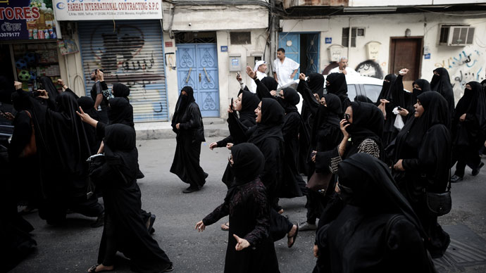 Bahraini women shout slogans as they march during an anti-regime rally in solidarity with jailed human rights activist Nabeel Rajab and against the upcoming Bahrain Formula One Grand Prix in Manama on March 29, 2013. (AFP Photo / Mohammed AL-Shaikh)