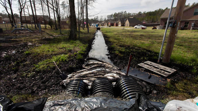 Spilled crude oil is seen in a drainage ditch near Starlite Road in Mayflower, Arkansas March 31, 2013 (Reuters / Jacob Slaton)