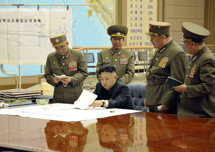 North Korean leader Kim Jong-un (C) presides over an urgent operation meeting on the Korean People's Army Strategic Rocket Force's performance of duty for firepower strike at the Supreme Command in Pyongyang, early March 29, 2013 (Reuters/KCNA)