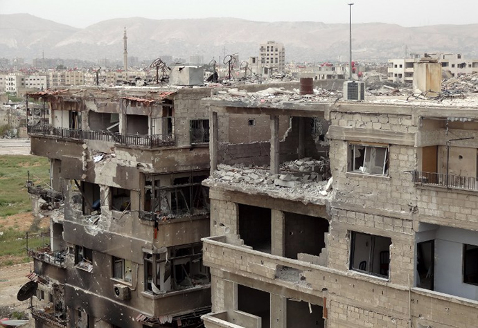 Heavily damaged buildings in Zamalka, a suburb of Damascus, on March 31, 2013. (AFP Photo / Shaam News Network)