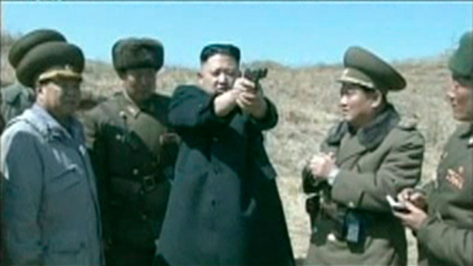 North Korea's leader Kim Jong-un holds up a pistol as he supervises pistol and automatic file firing drills at the second battalion under North Korea People's Army (KPA), in this still image taken from video footage released on April 5, 2013.(Reuters / KRT via Reuters Tv)