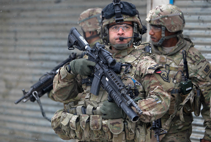 U.S. troops with the International Security Assistance Force (ISAF) keep watch at the site of a suicide attack in Kabul, February 27, 2013 (Reuters / Omar Sobhani)