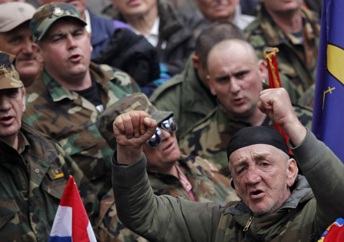 Croatian war veterans sing songs during a protest against Cyrillic signs at Zagreb's main square April 7, 2013. (Reuters/Antonio Bronic)