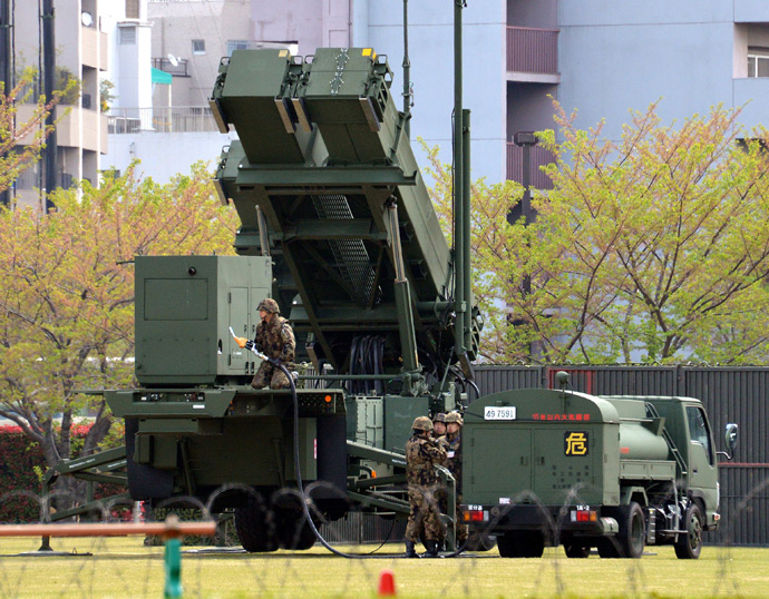A Patriot Advanced Capability-3 (PAC-3) missile launcher is refueled from a tank truck at the Defence Ministry in Tokyo on April 11, 2013 (AFP Photo / Yoshikazu Tsuno)