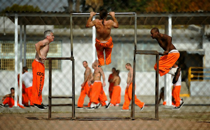 Inmates at Chino State Prison exercise in the yard in Chino, California. (AFP Photo / Kevork Djansezian)