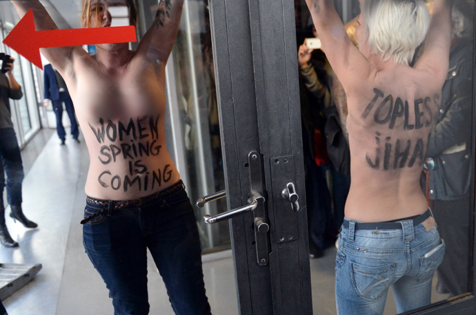 Femen militants protest during a press conference by Tunisian President Moncef Marzouki (unseen) in Paris on April 12, 2013 (AFP Photo / Eric Feferberg)