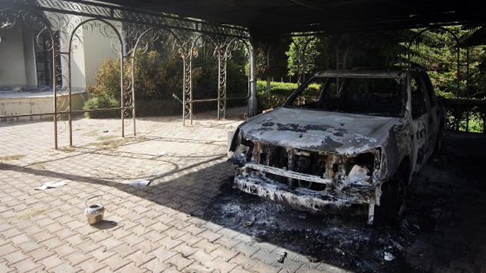 A picture shows a burnt vehicle inside the US consulate compound in Benghazi on September 13, 2012. (AFP Photo / Gianluigi Guercia)