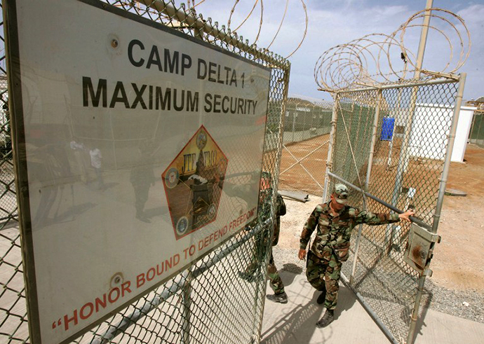 A US Army guard opens the gate at Camp Delta at Guantanamo Naval Base 23 August, 2004 in Guantanamo, Cuba. (AFP Photo / Mark Wilson)