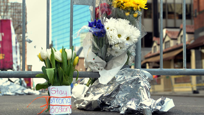 Flowers and a message are left on Newbury Street April 16, 2013 in Boston.(AFP Photo / Stan Honda)