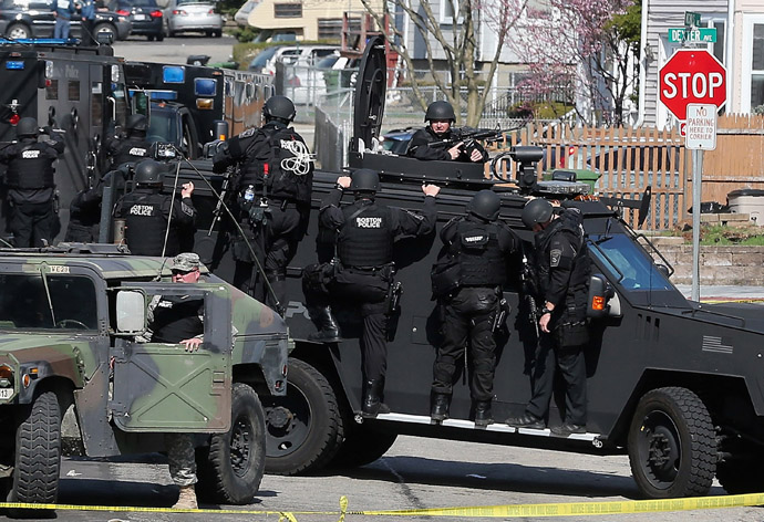 Members of a SWAT team search for 19-year-old bombing suspect Dzhokhar A. Tsarnaev on April 19, 2013 in Watertown, Massachusetts. (Mario Tama/Getty Images/AFP)