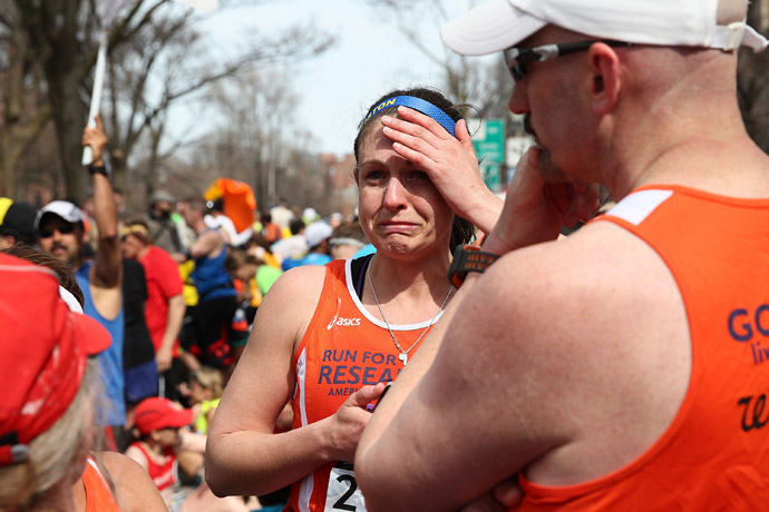 A runner reacts near Kenmore Square after two bombs exploded during the 117th Boston Marathon on April 15, 2013 in Boston, Massachusetts (Alex Trautwig / Getty Images / AFP) 