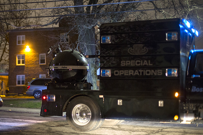 A law enforcement vehicle carries a bomb disposal device through Watertown during a search for the two men suspected of setting off two explosions during the Boston Marathon in Watertown, Massachusetts, April 19, 2013. (Reuters / Lucas Jackson)