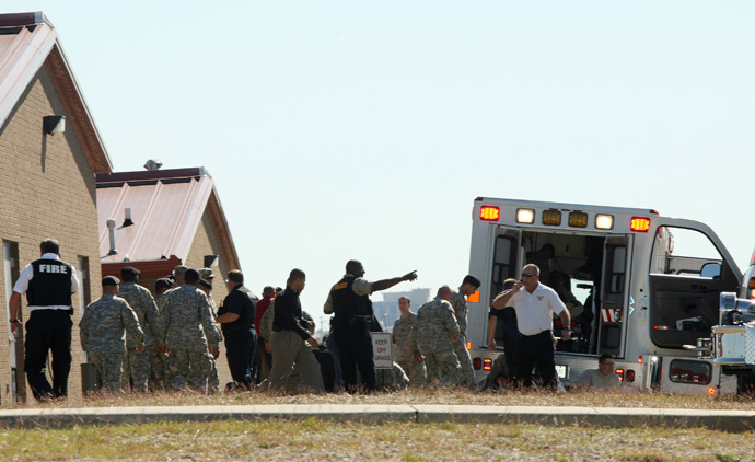 First responders prepare the wounded for transport in waiting ambulances outside Fort Hood's Soldier Readiness Processing Center, after a mass shooting at the military base November 5, 2009 (Reuters)