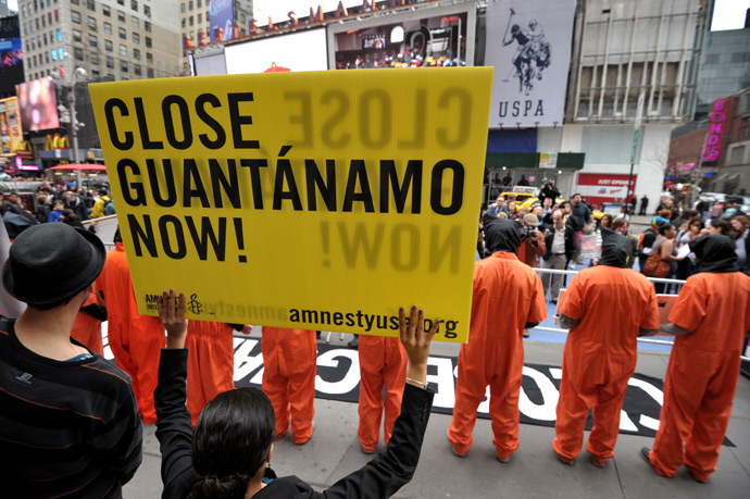Activists demand the closing of the US military's detention facility in Guantanamo during a protest, part of the Nationwide for Guantanamo Day of Action, April 11, 2013 in New York's Times Square (AFP Photo / Stan Honda)