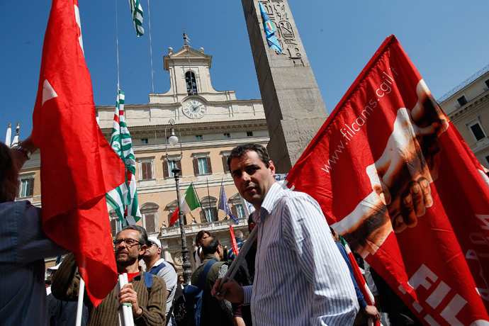 Members of Italy's main trade unions, Italian General Confederation of Labour (CGIL), Italian Confederation of Workers' Trade Unions (CISL) and Italian Labour Union (UIL), demonstrate to draw attention on the worsening conditions of the Italian workforce, in front of the Lower House of Parliament in Rome April 16, 2013 (Reutres / Tony Gentile)