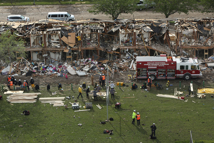 Search and rescue workers comb through what remains of a 50-unit apartment building the day after an explosion at the West Fertilizer Company destroyed the building April 18, 2013 in West, Texas. (Chip Somodevilla/Getty Images/AFP )