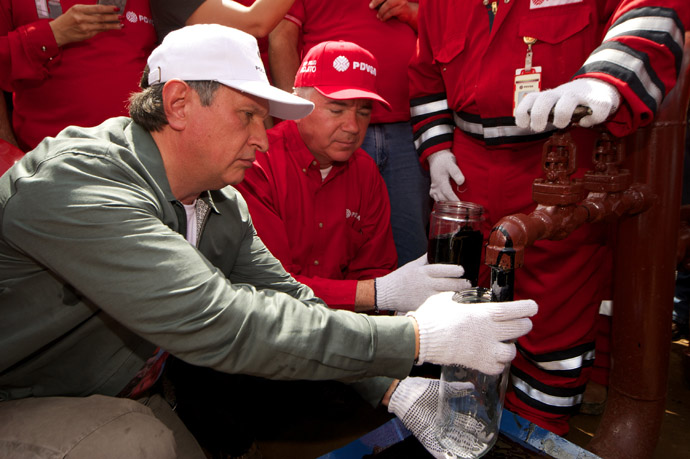 Rosneft head Igor Sechin, left, on a working trip to Venezuela. (RIA Novosti)