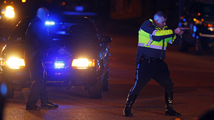 Police officers keep a man on the ground in Watertown, Massachusetts April 19, 2013 following the shooting of a police officer at the Massachusetts Institute of Technology (MIT). (Reuters / Brian Snyder)