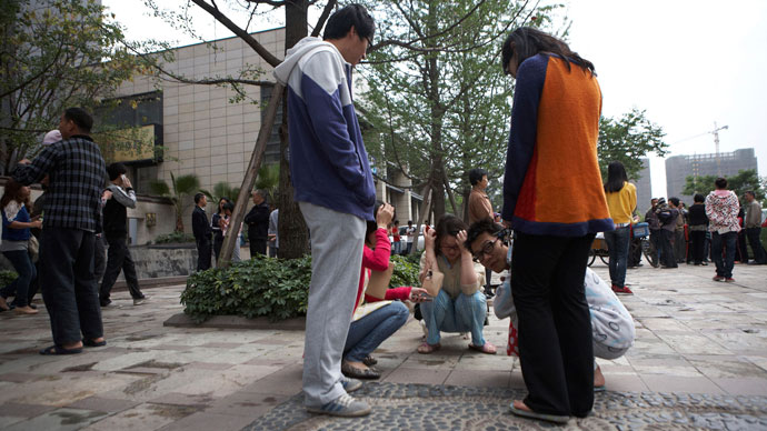 Residents leave their homes and gather in a public square after a 6.6 magnitude earthquake which struck near Ya'an city, in Chengdu, Sichuan province, April 20, 2013.(Reuters / Stringer)