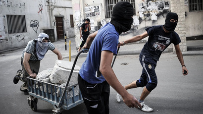 Bahrain issues 31 fifteen-year jail terms over police attack