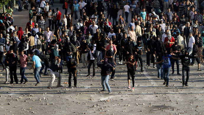 Anti-government protesters throw stones at Muslim Brotherhood members during clashes near Cairo's Tahrir Square April 19, 2013.(Reuters / Mohamed Abd El Ghany)