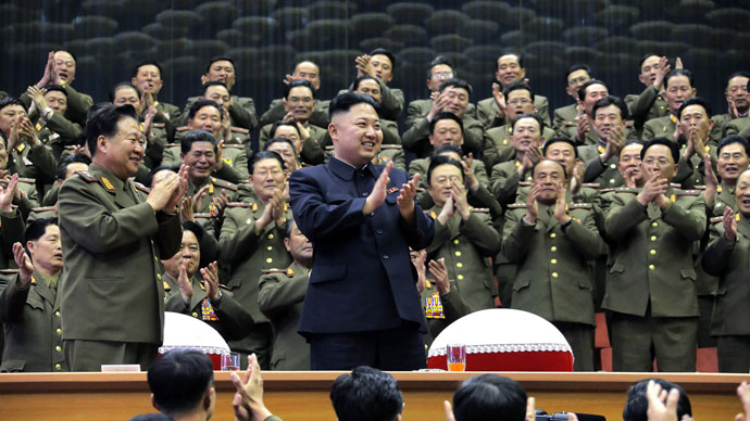 North Korean leader Kim Jong-Un (C) clapping with teachers and cadets from military academies as he enjoys a sports contest between Kim Il-Sung Military University and Kim Il-Sung University of Politics in Pyongyang. As North Korea marked the birth of late founding leader Kim Il-Sung.(AFP Photo / KCNA via KNS)