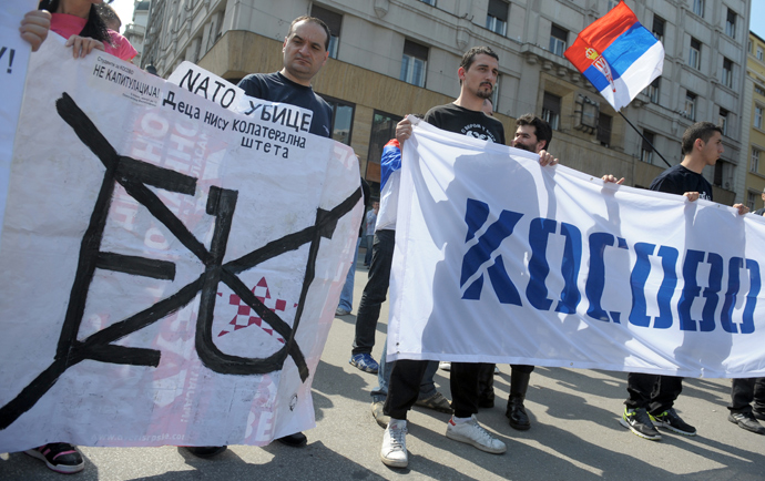 A group of Serbian protesters hold anti EU banners and reading "NATO Killers" and "Kosovo" during a protest on April 21, 2013, in Belgrade. (AFP Photo / Alexa Stankovic) 