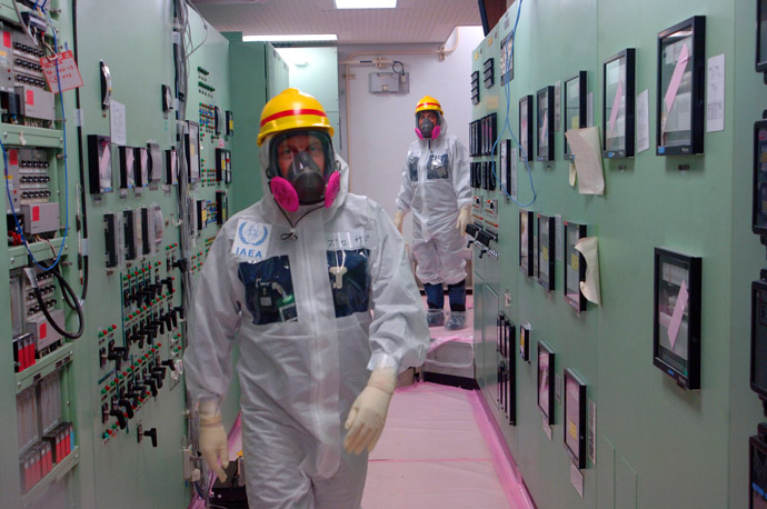 This handout picture taken by the International Atomic Energy Agency (IAEA) on April 17, 2013 shows members of the IAEA Division of Nuclear Fuel Cycle and Waste Technology inspecting the control room of the unit one and two reactor buildings of the crippled TEPCO Fukushima Dai-ichi nuclear power plant in Okuma, Fukushima prefecture. (AFP Photo/IAEA)