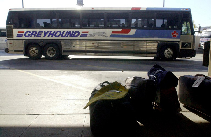 An empty Greyhound bus pulls into the Greyhound Bus Terminal. (AFP Photo / Jeff Kowalsky)