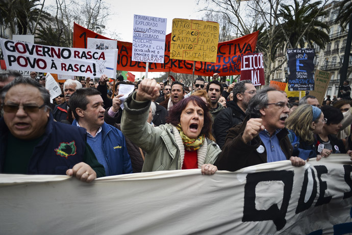 People wave placards as they protest during a demonstration in downtown Lisbon on March 2, 2013. (AFP Photo)