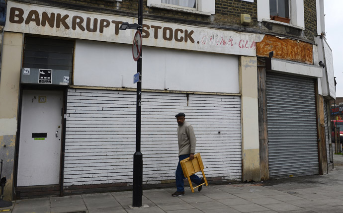 A man walks past a closed down shop in east London, January 25, 2013. (Reuters)
