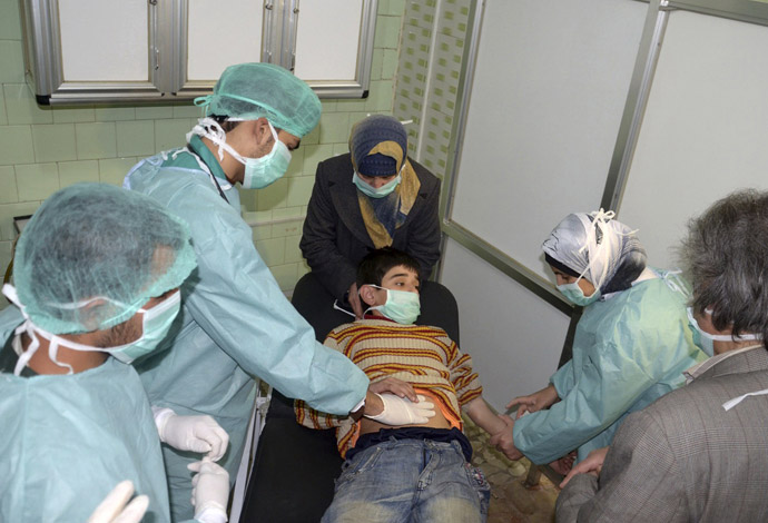 A boy, affected in what the government said was a chemical weapons attack, is treated at a hospital in the Syrian city of Aleppo March 19, 2013. (Reuters/George Ourfalian)