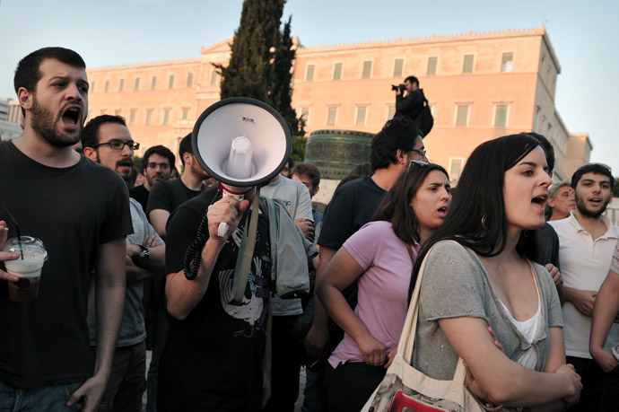 Protesters shout as they demonstrate in front of the parliament in Athens on April 28, 2013. (AFP Photo/Louisa Gouliamaki)