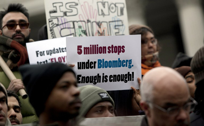 A man holds a sign during a demonstration against the city's "stop and frisk" searches in lower Manhattan near Federal Court March 18, 2013 in New York City. (AFP Photo / Getty Images / Allison Joyce)