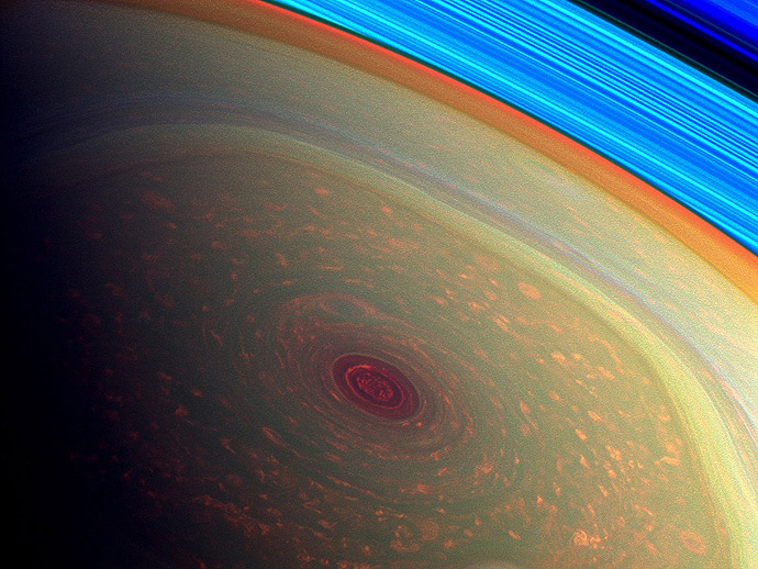 This spectacular, vertigo inducing, false-color image from NASA's Cassini mission highlights the storms at Saturn's north pole. (NASA/JPL-Caltech/SSI) 