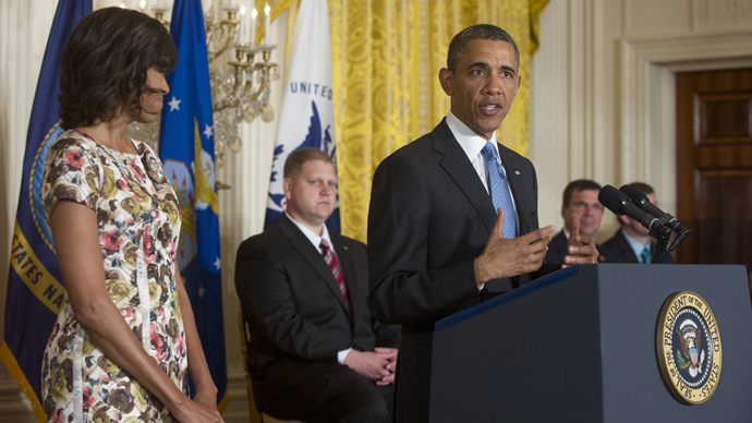 US President Barack Obama speaks alongside First Lady Michelle Obama in Washington on April 30, 2013 (AFP Photo / Saul Loeb)